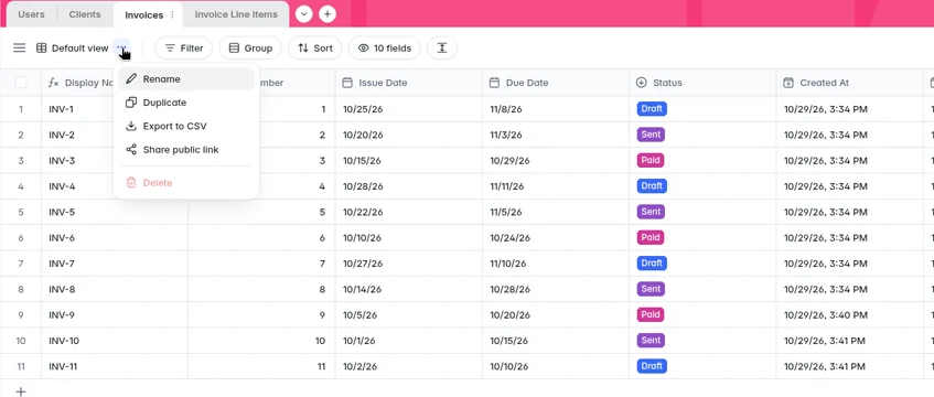 Softr database Invoices table with the view menu open, showing the Export to CSV option (test and sample data)