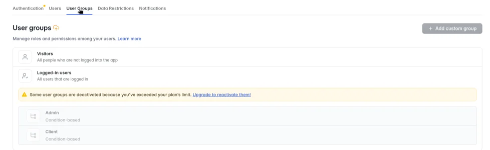 Softr Studio User Groups page on the Basic plan: warning that user groups are deactivated because of the plan limit, with the Admin and Client groups greyed out
